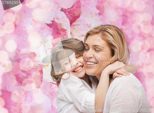 Image of happy mother and daughter hugging