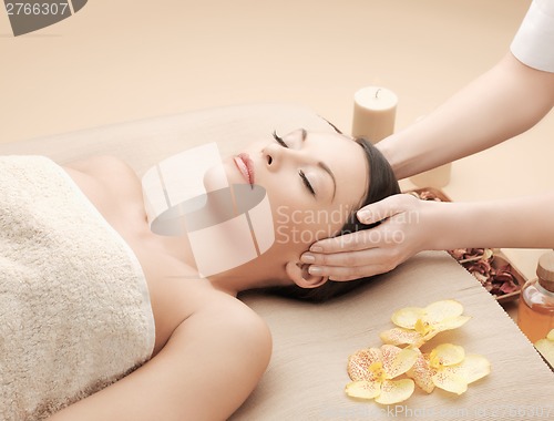 Image of beautiful woman in massage salon