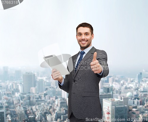 Image of smiling buisnessman with tablet pc computer