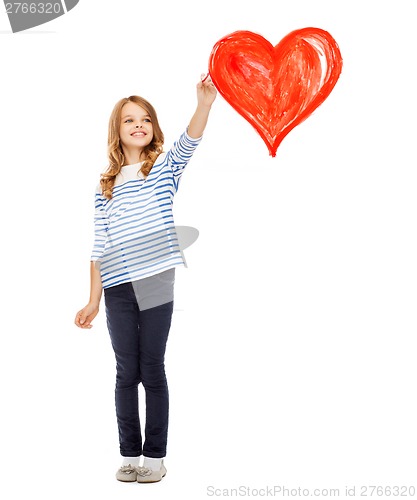 Image of girl drawing big red heart in the air