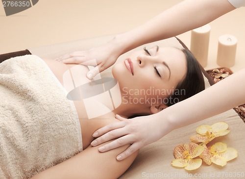 Image of beautiful woman in massage salon