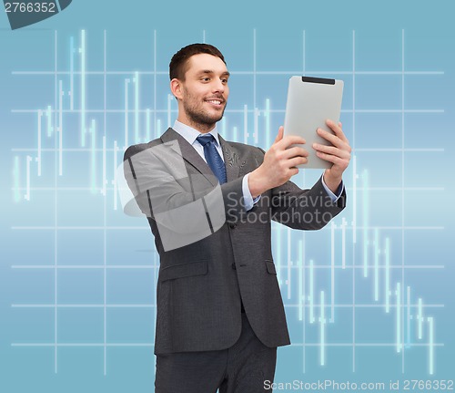 Image of smiling buisnessman with tablet pc computer