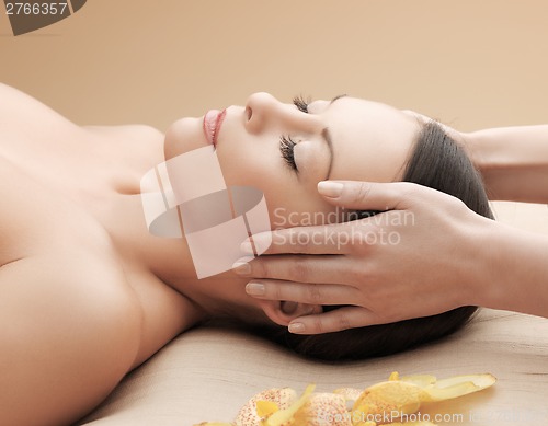 Image of beautiful woman in massage salon