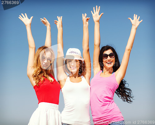 Image of group of girls chilling on the beach