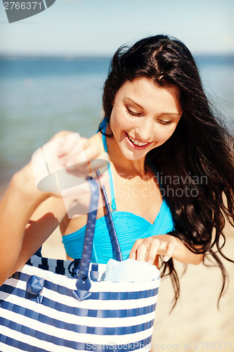 Image of girl sunbathing on the beach