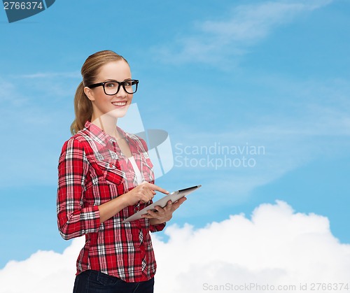 Image of smiling girl in eyeglasses with tablet pc computer