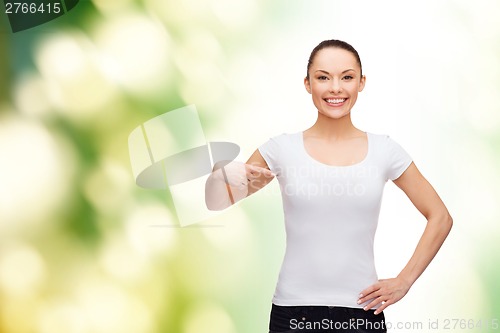 Image of smiling woman in blank white t-shirt