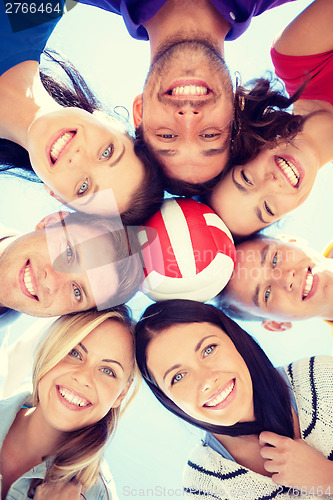 Image of group of teenagers looking down