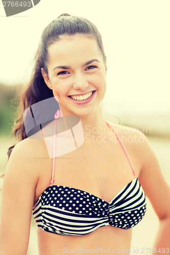 Image of girl posing on the beach