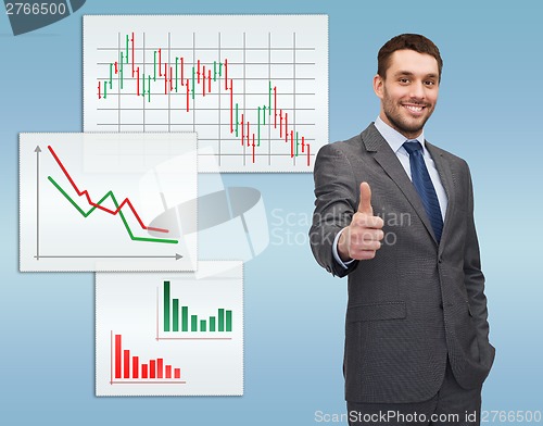 Image of handsome buisnessman showing thumbs up