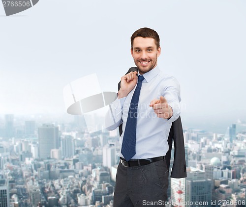 Image of handsome buisnessman with jacket over shoulder