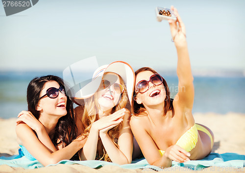 Image of girls taking self photo on the beach