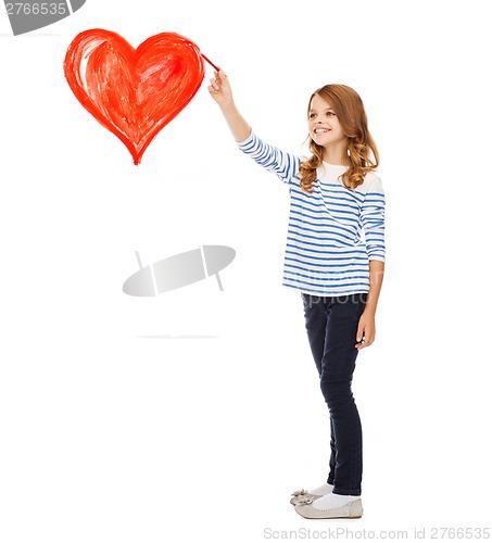 Image of girl drawing big red heart in the air