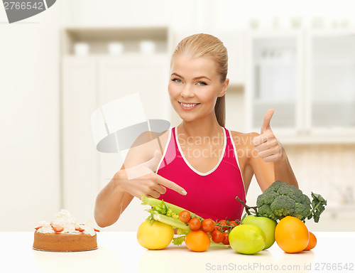 Image of woman pointing at healthy food