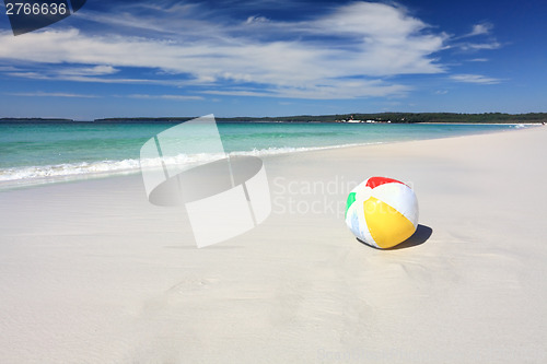 Image of Colourful beach ball on the seashore by the ocean