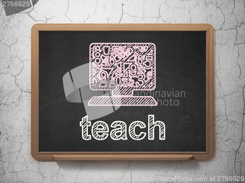 Image of Education concept: Computer Pc and Teach on chalkboard background