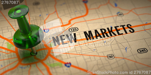 Image of New Markets - Green Pushpin on a Map Background.