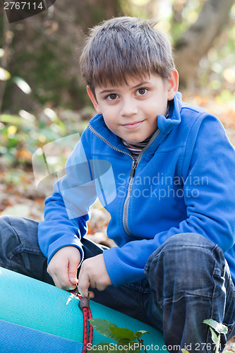 Image of Little boy in forest