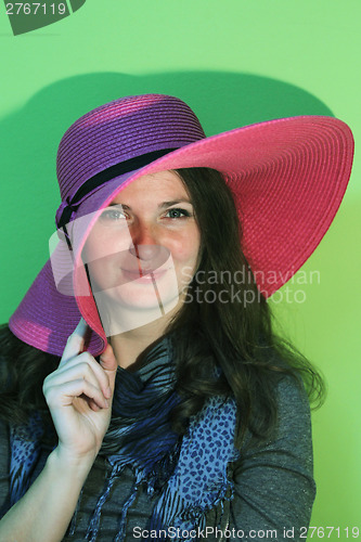 Image of Brunette with pink hat