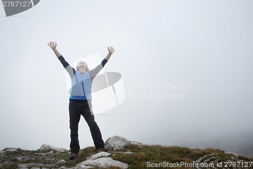 Image of Man enjoying the mountain