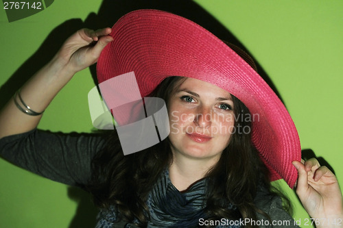 Image of Brunette with pinky hat