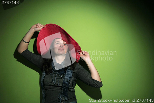 Image of Pretty brunette with hat