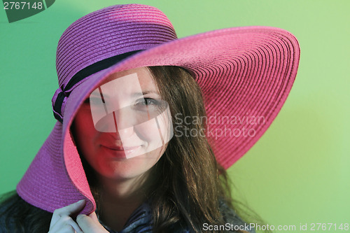 Image of Lovely brunette with pink hat