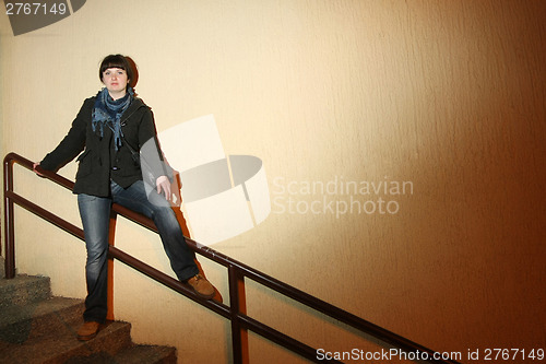 Image of Brunette posing on fence