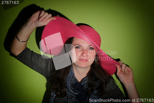 Image of Woman with pinky hat