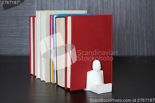 Image of Books on a wooden shelf