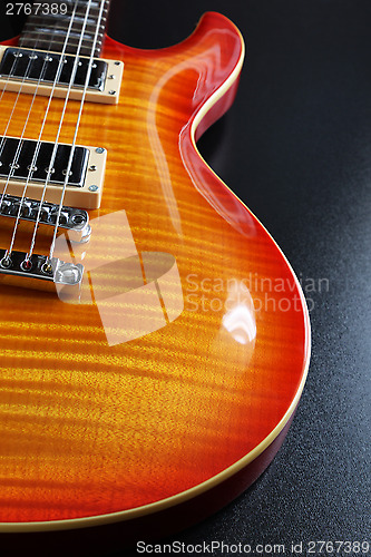 Image of Cherry sunburst electric guitar