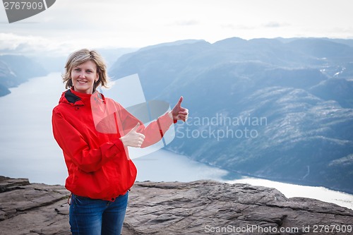 Image of Woman hiker on Pulpit Rock / Preikestolen, Norway