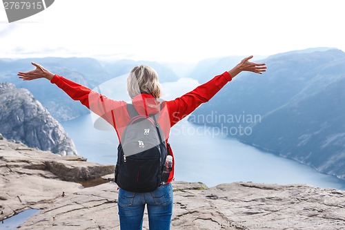 Image of Woman hiker on Pulpit Rock / Preikestolen, Norway