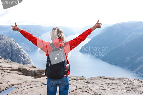 Image of Woman hiker on Pulpit Rock / Preikestolen, Norway