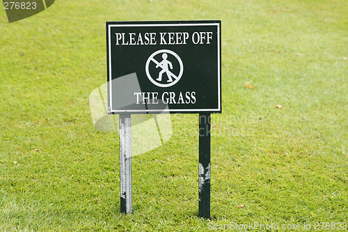 Image of please keep off the grass sign taken in england july 2007