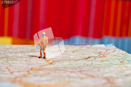 Image of Miniature people in action on a roadmap