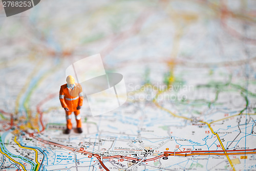 Image of Miniature people in action on a roadmap