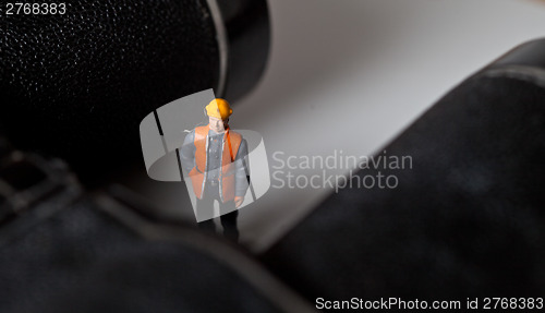 Image of Miniature people in action with magnification glasses