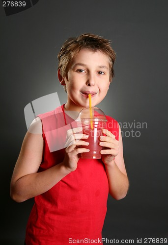 Image of Child drinking fresh berry juice