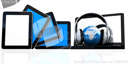 Image of headphones and  earth on the  laptop and tablet pc