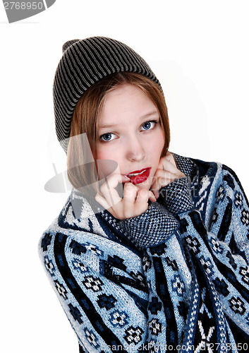 Image of Girl in sweater and hat.