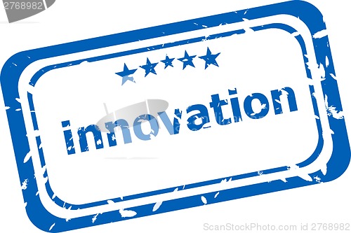 Image of innovation on rubber stamp over a white background