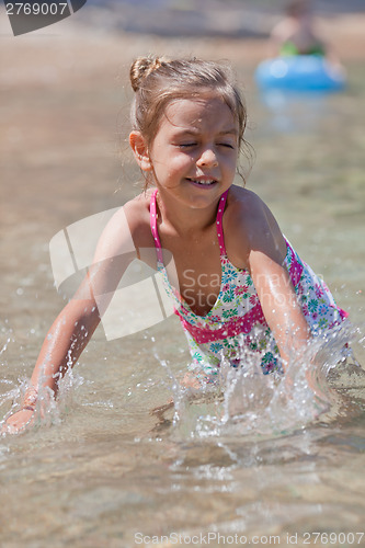 Image of Happy little girl and sea