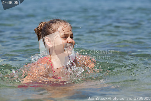 Image of Young girl in the sea