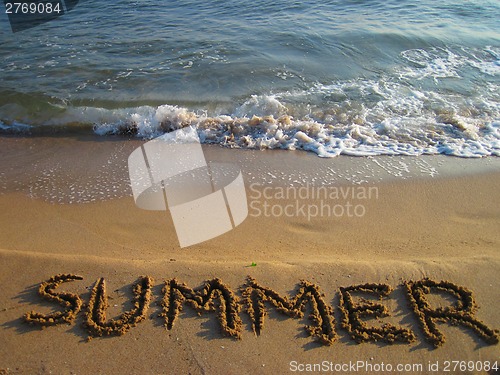 Image of summer - text in the sand