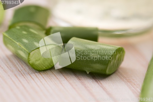 Image of aloe vera juice with fresh leaves
