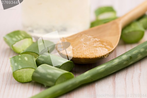 Image of aloe vera juice with fresh leaves