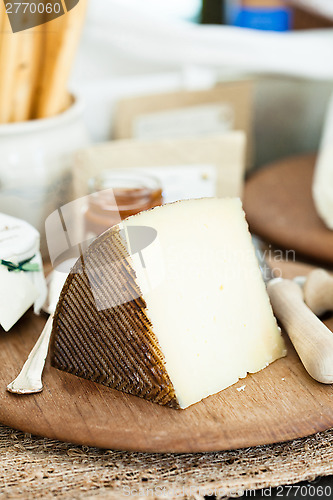 Image of Cheese on wooden board