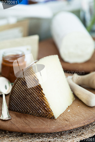 Image of Cheese on wooden board