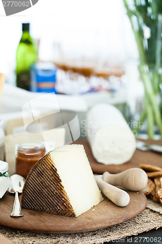 Image of Cheese on wooden board